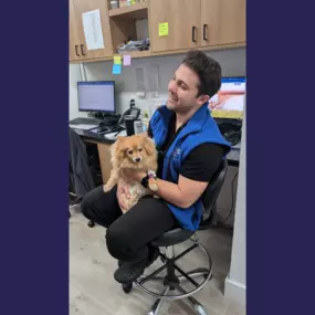 Overpeck Creek Animal Hospital team member giving snuggles to a patient.