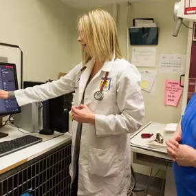 Dr. Erin Scott examines an x-ray using advanced, digital radiology technology.