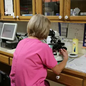 A member of our veterinary staff is using our in-house laboratory to test for conditions that cannot be seen by the naked eye. Having these tools right in our facility allows us to return results back to you more quickly and efficiently, so that we can provide proper treatment as soon as possible.