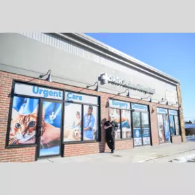 Dr. Funk, a veterinarian at Oath Animal Hospital in East Meadow, NY, stands proudly outside the clinic.