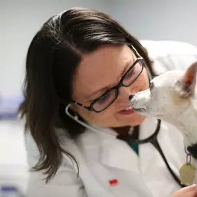 Dr. Stephanie Lantry gladly accepts doggy kisses from her forever friend.