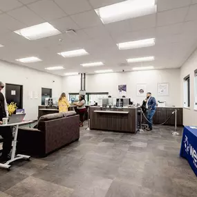 Interior lobby of federal credit union with finance professionals