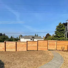This is an example of a high-quality large cedar fence install, we are fully equipped to handle any sized job.