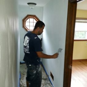Just our crew is hard at work painting the inside of this home.