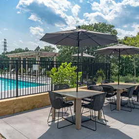 Outdoor area with pool and tables