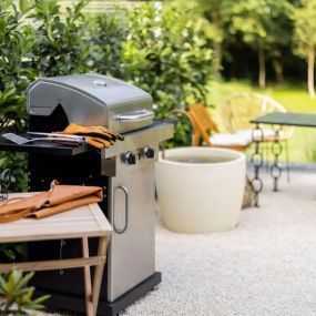 Gas grills and outdoor dining spaces.