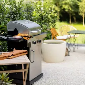 Gas grills and outdoor dining spaces.