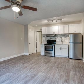 kitchen and dining room with a ceiling fan