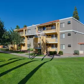 two story building exterior with grass lawn