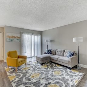 spacious living room with couch and accent chair