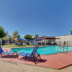 swimming pool with lounge chairs