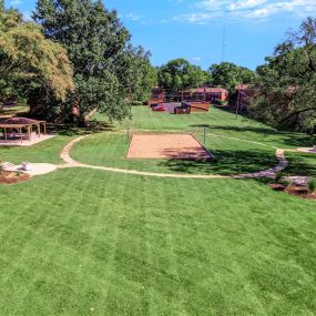 grass lawn with sand volleyball court