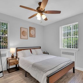 bright airy bedroom with ceiling fan