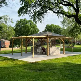 outdoor grill space with green grass lawn