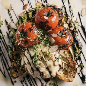 We’re committed to seasonality and are proud to feature the finest, local ingredients on our menu. ????????????
Pictured is our Blistered Campari Tomato appetizer. Made with handmade burrata, grilled house-made focaccia, almond pesto, balsamic reduction, extra virgin olive oil & micro basil