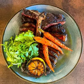 Elevate your dining experience with our 32 oz. Dry-Aged Bistecca Alla Fiorentina. ????????

Perfectly seared, rich in flavor, and served with charred lemon and roasted carrots. It's the ultimate indulgence—ready to share, if you dare.