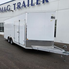 Discover the custom-built Aluminum Cargo Trailer with barn doors at M&G Trailer Sales, boasting a range of features such as double side doors, torsion axles, loading lights, a clean finished interior, extended tongue, loading ramps, and an impressive 7515lb payload capacity.