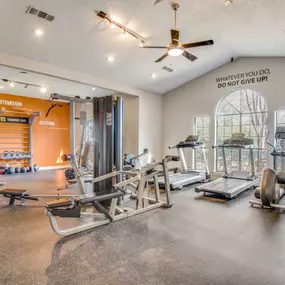 large fitness center with cardio equipment and weight machines