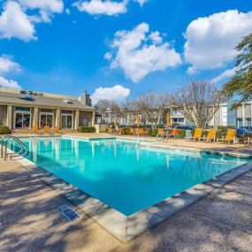 outdoor swimming pool with lounge chairs