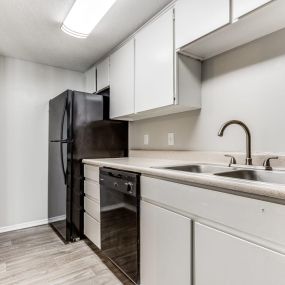 clean kitchen with black appliances