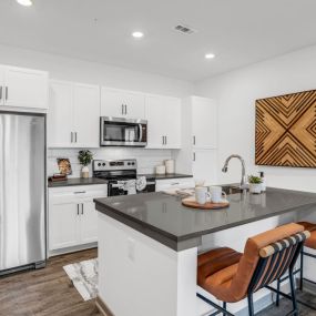 Kitchen with white cabinets and a big countertop