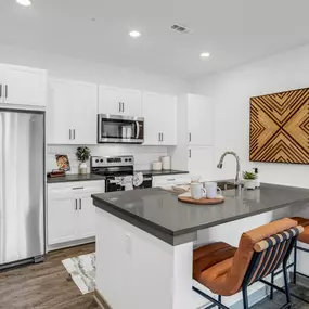 Kitchen with white cabinets and a big countertop