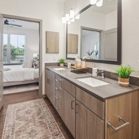 A bathroom with a sink and a mirror