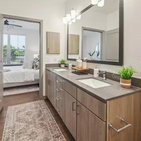 A bathroom with a sink and a mirror