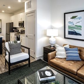 Studio, one, and two-bedroom apartment homes with stainless steel appliances, quarts countertops, designer cabinetry, large kitchens, luxury vinyl plank flooring, high vaulted ceilings, high-end lighting, in-unit washer and dryer, and energy efficient windows at Fireside at Waukee in Waukee, IA