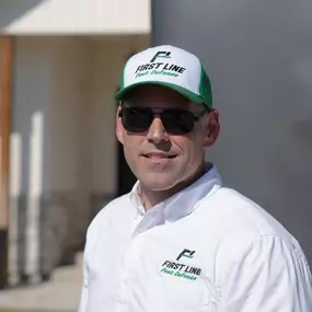 Headshot of a friendly First Line Pest Defense technician smiling and ready to provide reliable pest control.