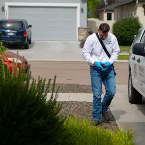 A First Line Pest Defence professional prepares for a residential pest control service in Boise, ID. Our technicians arrive in uniform and marked vehicles, using modern technology to manage service calls and communicate effectively. This commitment to professionalism ensures every client receives reliable, organized, and thorough pest management solutions.