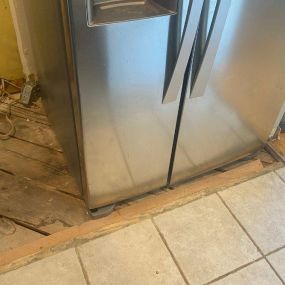 Pictured here is Siren Wisconsin water damage from a leaking refrigerator water line that caused mold to grow on the kitchen subflooring and into the basement.
