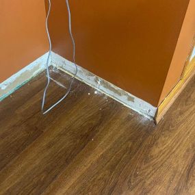 Pictured here is Siren Wisconsin water damage in a basement.  In the picture, we removed the floor trim to see the extent of the mold growth.