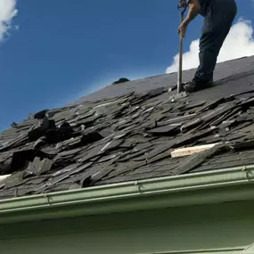 Pictured here is Webster Wisconsin water damage caused by hail damage.  As this picture shows, we are removing the hail-damaged shingles to repair the roof deck and replace the roof.