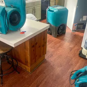 Pictured here is Webster Wisconsin water damage restoration in a kitchen.  We only use commercial-grade equipment as this picture shows.