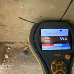 Pictured here is a moisture meter for Luck Wisconsin water damage.  We use a moisture meter to detect water behind walls.  As you can see, this area of drywall is 59% wet.