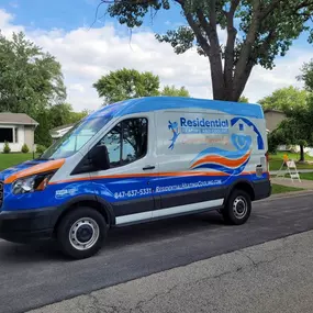 Residential Heating and Cooling Van parked in front of client home