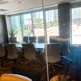 M&M Private Lending Group's conference room, featuring a large meeting table, comfortable seating, and state-of-the-art presentation equipment, set up for client consultations.