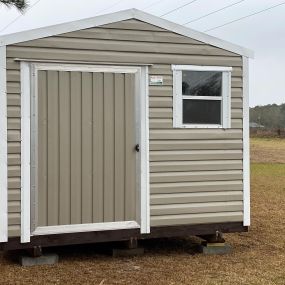 Portable shed with door and window - tan