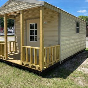 Portable shed with door and window and porch