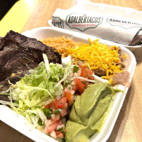 Two pieces of fresh grilled carne asada served with a side of guacamole, fresh pico de gallo, a side of rice and beans. Comes with your choice of flour or corn tortilla.