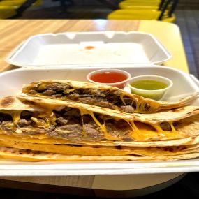 Grilled Carne asada, stuffed with a generous portion of cheese all wrapped in a Crunchy flour tortilla.