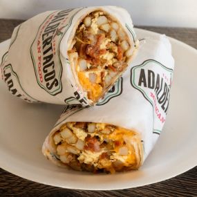 Scrambled eggs, crispy bacon, crispy potatoes, and fresh Cheddar cheese all wrapped in a soft flour tortilla.