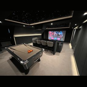 An unused Games Room was transformed into the ultimate luxury entertainment space for sports events and movies alike.