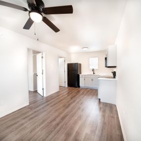Newly remodeled one and two-bedroom floor plans with premium appliances, custom cabinetry, quartz countertops, premium LVT flooring, and in-unit washer and dryer at The Grove on Berry in Springdale, AR.