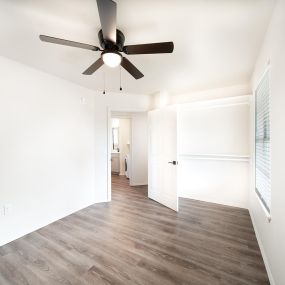 Newly remodeled one and two-bedroom floor plans with premium appliances, custom cabinetry, quartz countertops, premium LVT flooring, and in-unit washer and dryer at The Grove on Berry in Springdale, AR.