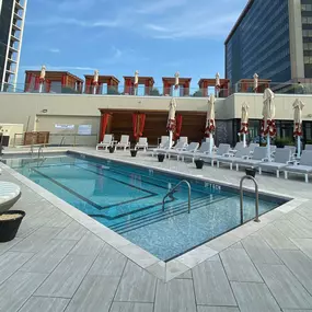 A view of Caesars Atlantic City's rooftop, highlighting The Pool. Soak up the sun at a newly renovated pool experience with stunning beach and ocean views, located on the Qua Baths & Spa rooftop. Enjoy cocktails poolside at this Roman oasis, and relax in a lounge chair, daybed or your own private cabana. Book now to reserve your spot. Must be a Caesars hotel guest and 21+ older to access The Pool at Caesars.