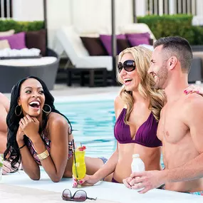 Two couples in The Pool at Harrah's Las Vegas - Fun in the sun! Get ready for some fun in the sun. At Harrah's Las Vegas, dive into the hotel’s heated outdoor swimming pool and relax in lush surroundings. Book your private cabana for the ultimate poolside VIP experience. Located on Level 2, the outdoor Pool at Harrah’s delivers on an epic Vegas poolside experience. Rent a cabana, lounge in the sun, and sip refreshing drinks. Lounge on a sunny daybed, or book a private cabana for some space of yo