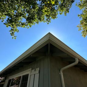 white gutters with downspout