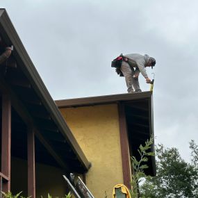 gutter installation on the edge of a roof